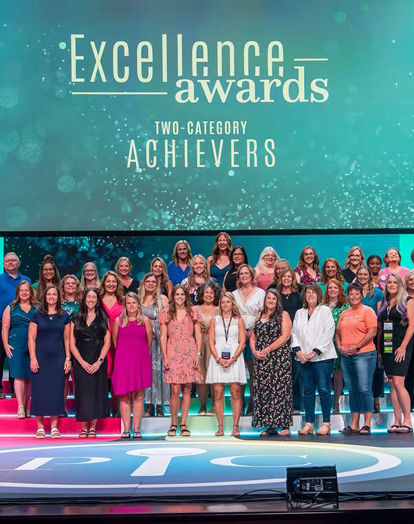 Conference excellence awards two-category achievers on stage