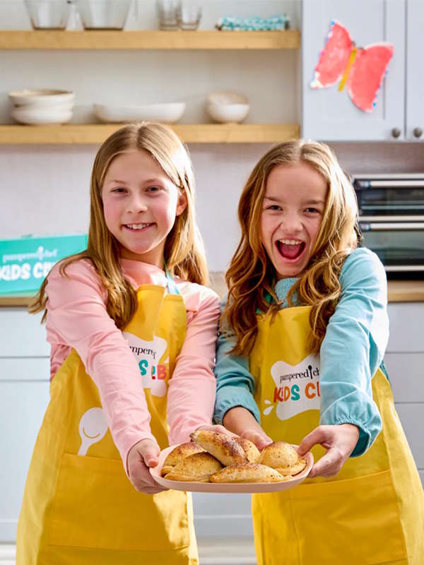 children serving food