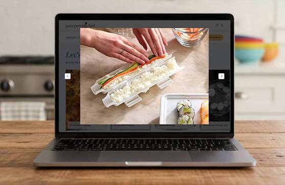 A laptop computer open and showing a Pampered Chef product