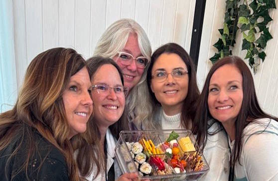 people holding a full snacklebox