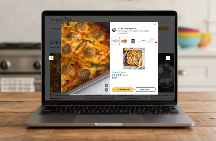 A laptop computer open and showing a Pampered Chef product