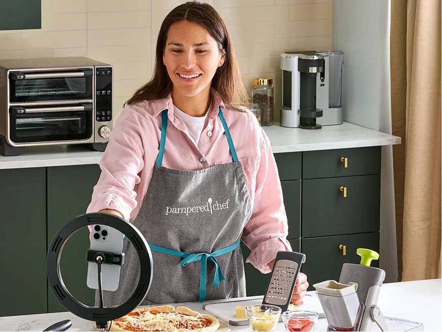 a consultant running a livestream from her kitchen