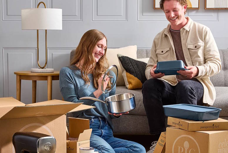 a young couple opening wedding shower gifts
