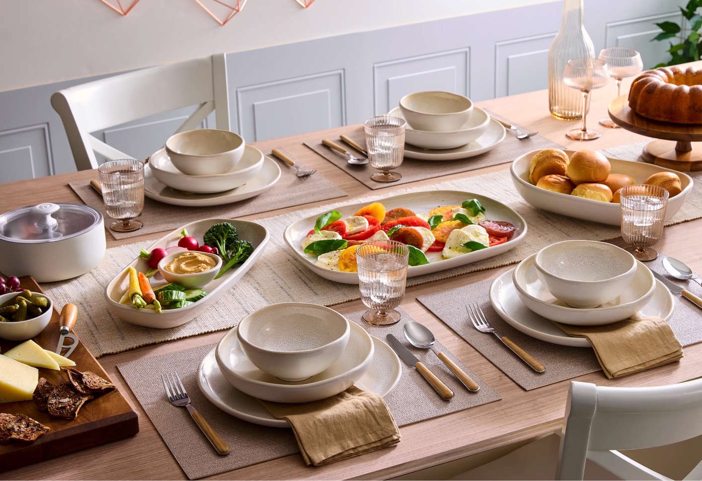 stoneware dinner set out on a table.