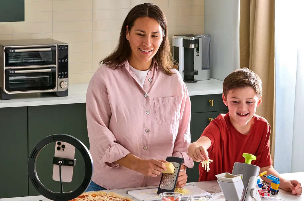consultant cooking with the assistance of a child.