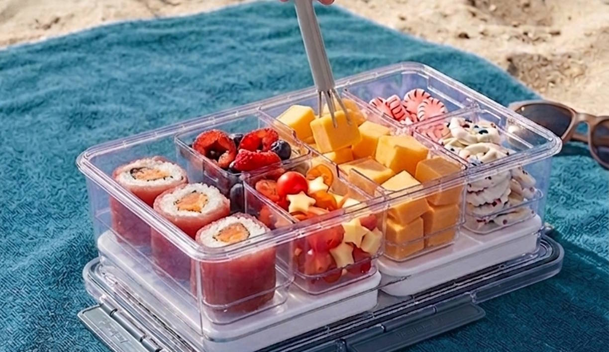 Demonstrating the new kit, Snacklebox on the beach